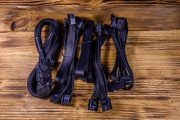 Set of computer psu cables on a wooden background