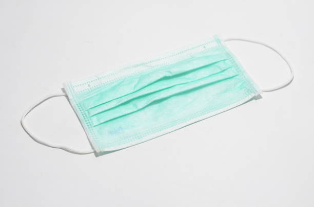 istock Medical face mask isolated on white background 1257617471