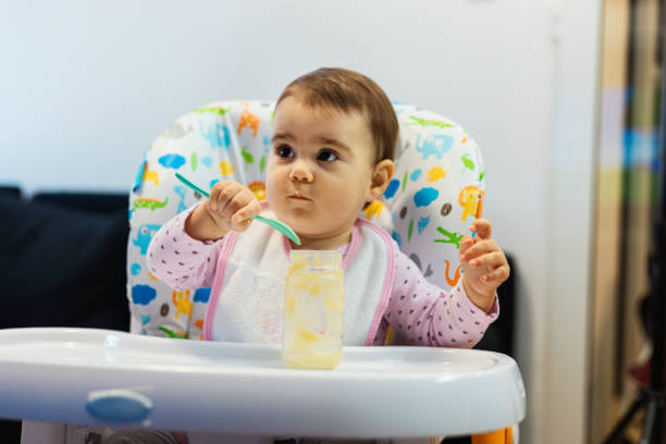 istock Baby eating a fruit porridge without fuss 1257620408