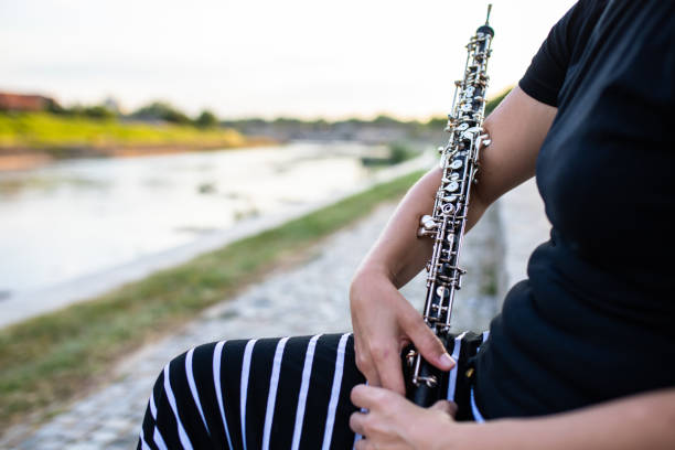 istock An oboe in a woman's hands 1257623779