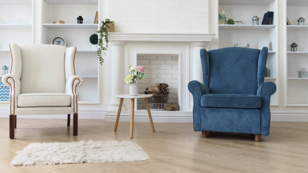 istock White and blue armchair with white modern table in front of fireplace 1257625690