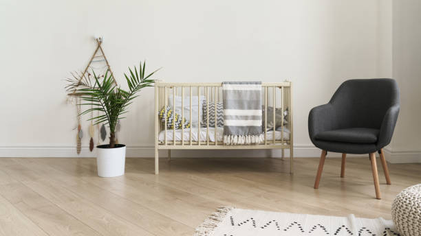 istock Cot bed and modern gray chair in baby bedroom 1257625708