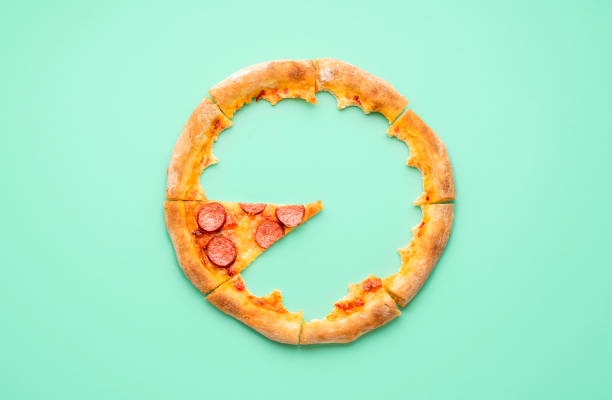 istock Pizza pepperoni crust only on a green background. Top view with pizza leftovers 1257631650