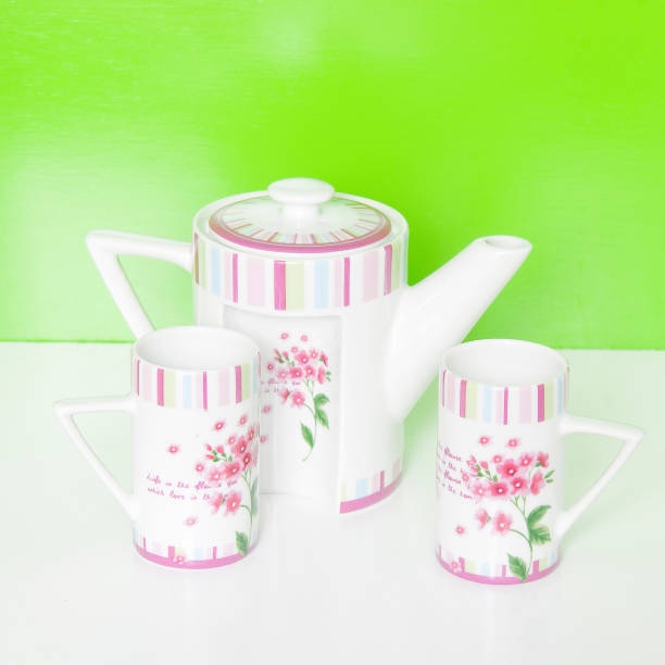 istock Set of four mugs and a pitcher to serve hot drinks. 1257631715