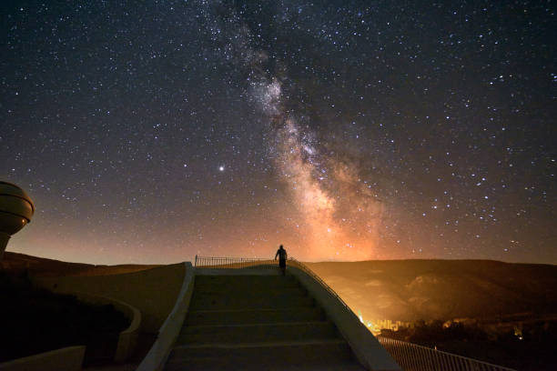 Person on grand staircase watching the Milky Way Person on grand staircase watching the Milky Way, Stars, night time, long exposure astrology sign photos stock pictures, royalty-free photos & images