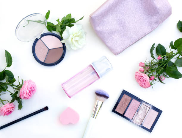 istock Flat lay layout with various cosmetic products and flowers on white background 1257639318