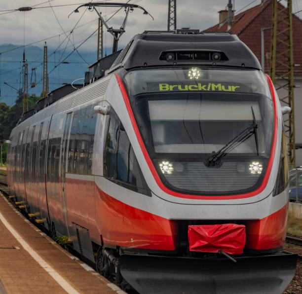 istock Knittelfeld station with electric red passenger unit in summer cloudy day 1257640536