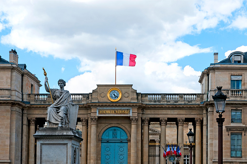Palais Bourbon : National Assembly building (Assemblée Nationale ) near place de la Concorde, with french flag flying.