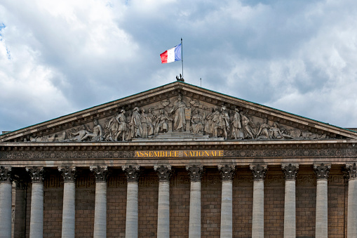 Palais Bourbon : National Assembly building (Assemblée Nationale ) near place de la Concorde, with french flag flying.