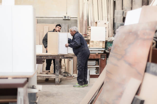 istock Carpenter working with wood in a lumberyard 1257641970