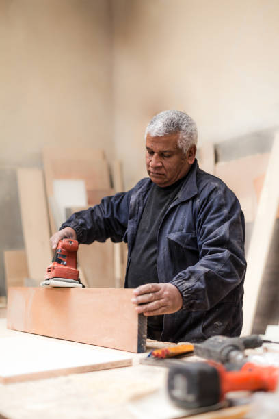 istock Carpenter working with wood in a lumberyard 1257642108