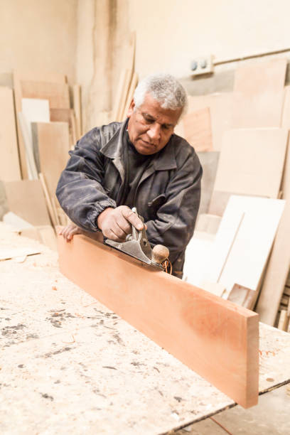 istock Carpenter working with wood in a lumberyard 1257642749