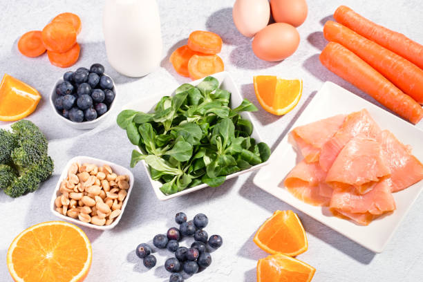 istock Foods that help maintain eyes healthy, supplements for keeping good vision, vitamins for eyes. Assortment of food for eye health on concrete background, flat lay, top view 1257643128