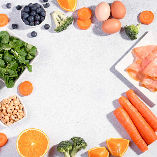 istock Foods that help maintain eyes healthy, supplements for keeping good vision, vitamins for eyes. Assortment of food for eye health on concrete background, flat lay, top view 1257643131