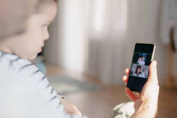 istock Father and son having online consultation with their doctor using mobile phone 1257643187
