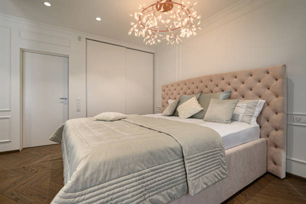 istock Big comfortable double bed in elegant classic bedroom 1257647617