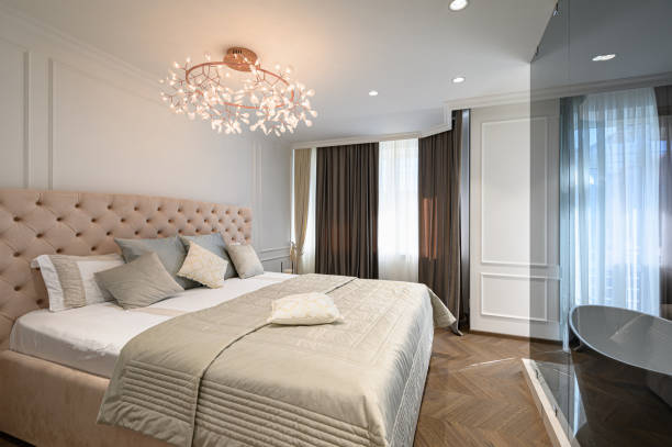 istock Big comfortable double bed in elegant classic bedroom 1257647756