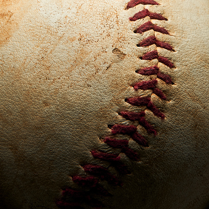 Macro image of a worn baseball