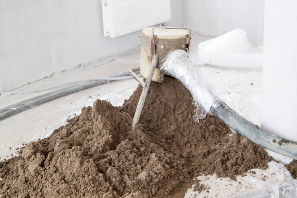 istock Sand and cement floor screed. Construction site - machine floor screed 1257654588