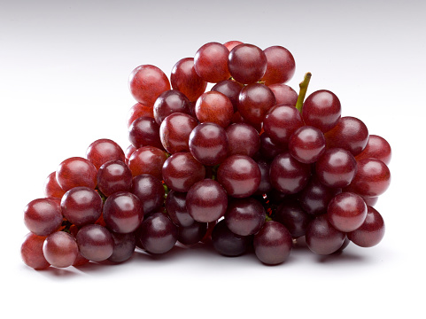 Red grape branch isolated on white background.