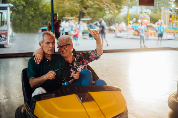 istock Seniors having fun in bumper car 1257656443
