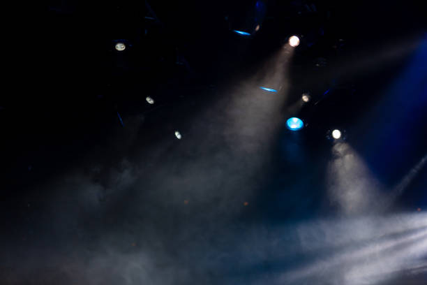 istock lights spotlights and smoke over the stage 1257664398