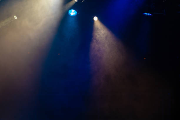istock stage light with colored spotlights and smoke 1257664417