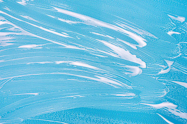 istock Cleaning background texture - chemical soap detergent foam on a clear glass 1257664430