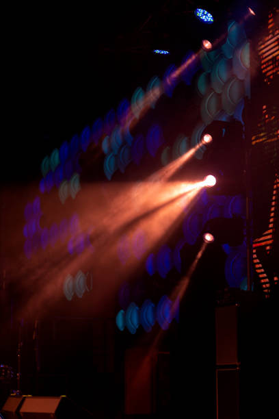 istock lights spotlights and smoke over the stage 1257664432