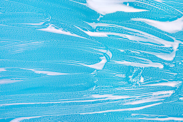 istock Cleaning background texture - chemical soap detergent foam on a clear glass 1257664440