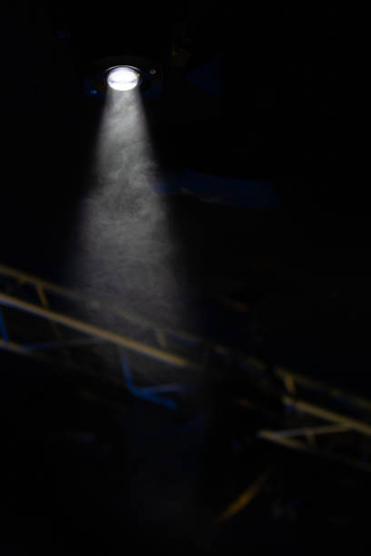 istock lights spotlights and smoke over the stage 1257664480
