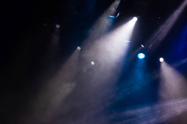 istock lights spotlights and smoke over the stage 1257664487