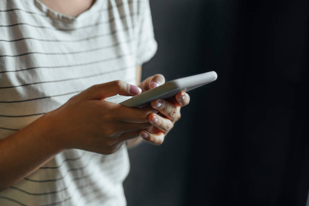istock People Using Technology: Close Up of a Woman's Hands Using a Smartphone 1257664686