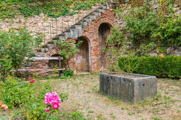 Europe, France, Dordogne, Hautefort. Stairway on an old brick wall in the town of Hautefort.