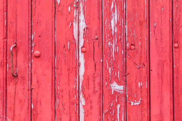 Europe, France, Dordogne, Hautefort. Red painted old door in the town of Hautefort.