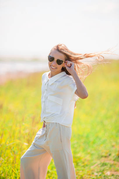istock Young beautiful girl having fun on tropical seashore. 1257665621