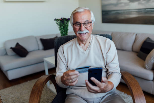 istock Senior man shopping online from home 1257671517