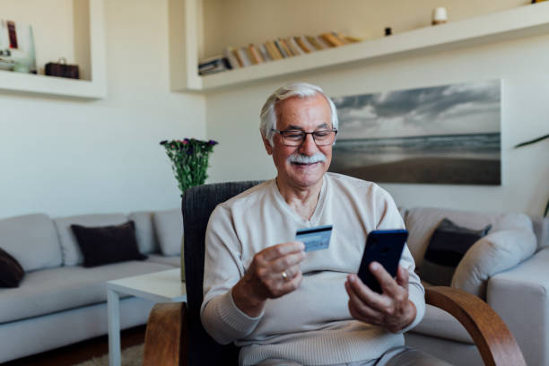 istock Senior man shopping online from home 1257671542