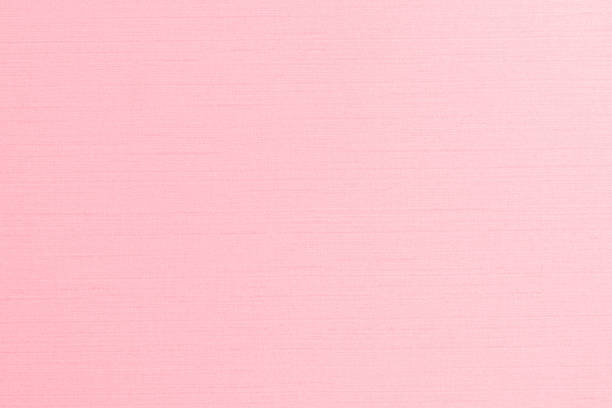 istock Silk fabric wallpaper texture pattern background in light pale sweet pink rose color 1257673018