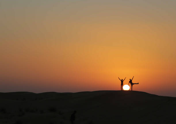 istock Celebration and success silhouette 1257674717