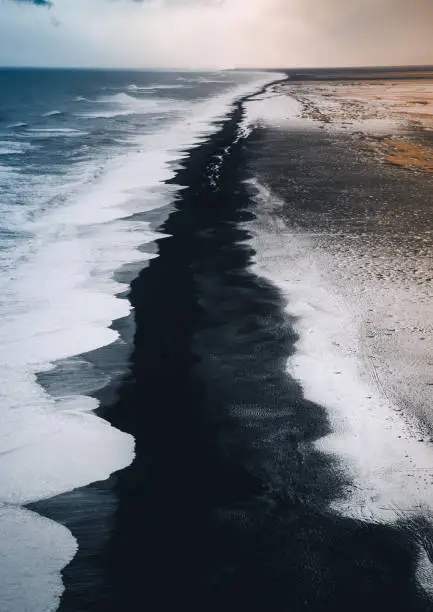 Blacksand beach in Iceland after a snowstorm.