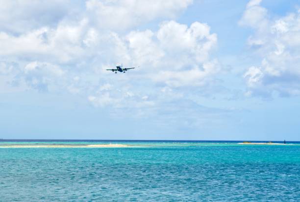 istock Jet aircraft in final approach landing at Caribbean island 1257674898
