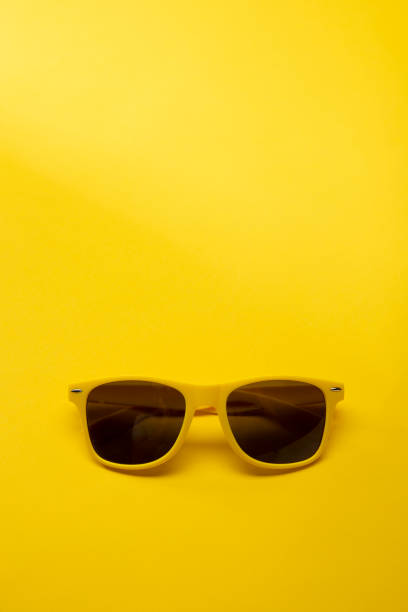 istock Bright Sunglasses on a Yellow Background 1257677486