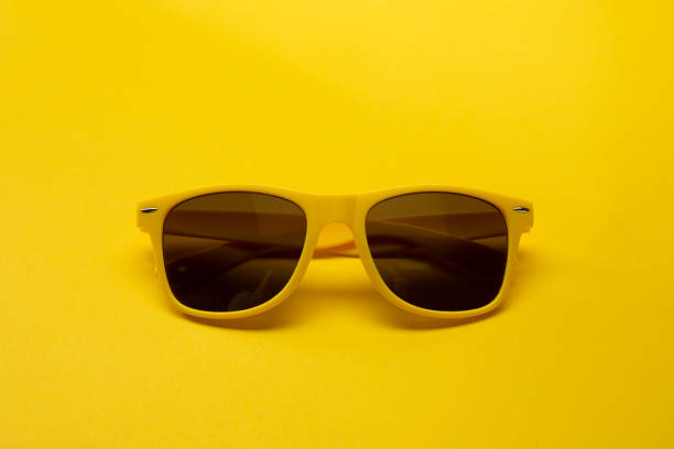 istock Bright Sunglasses on a Yellow Background 1257677500