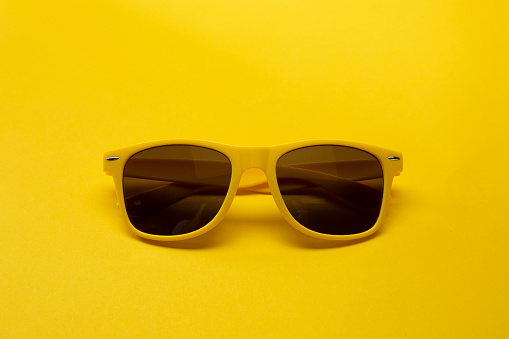 Yellow Sunglasses on a yellow background