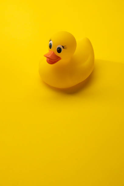 istock Bath Toy Rubber Duck on Yellow Background 1257678200