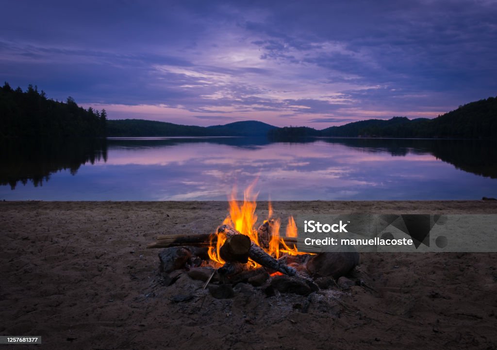 Burning campfire on the beach on my kayak camping trip Camping Stock Photo
