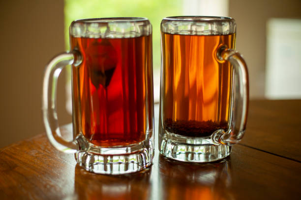 istock Fresh brewed tea on beer mugs 1257684196