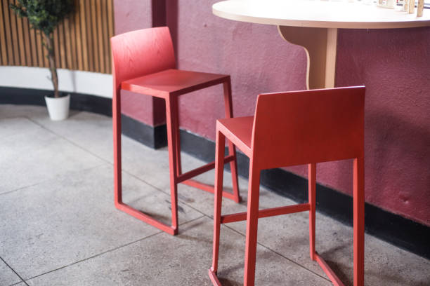 istock Pair of Red Chairs on a red Wall. 1257685368