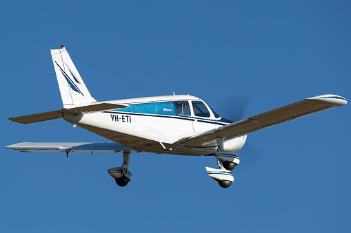 Tyabb, Australia - March 9, 2014: Piper Cherokee PA-28-140 single engine light aircraft VH-ETI taking off from Tyabb Airport.
